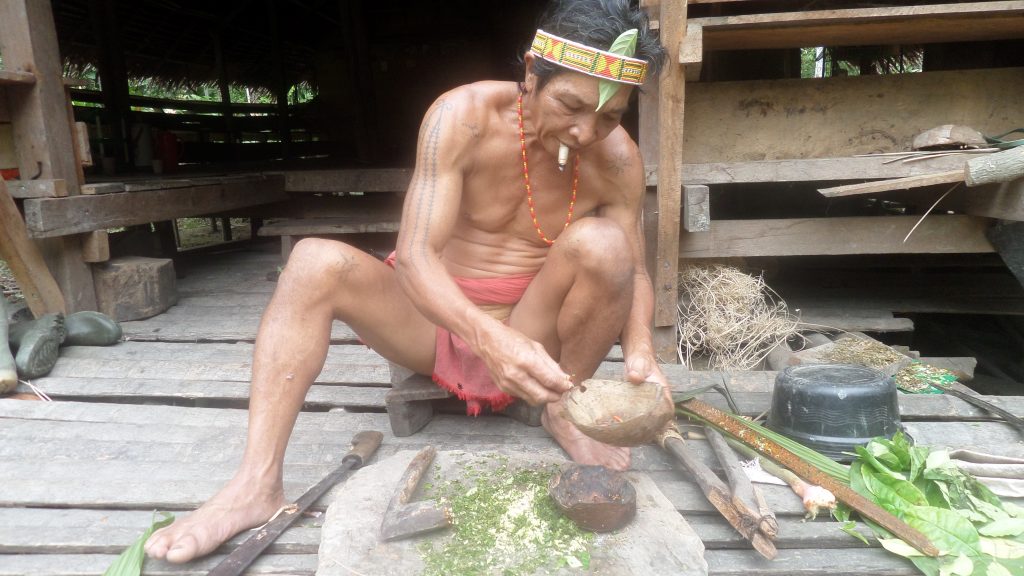 Shaman making poison for hunting