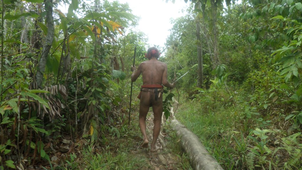Mentawai shaman going to plant trees