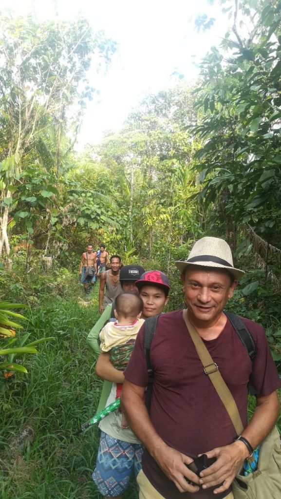 The Mentawai family and me walking in the jungle